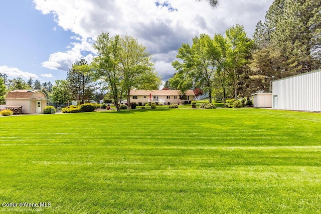 8416 N Haye Ln, Newman Lake, WA 99025 - view of grassy yard with an outdoor structure