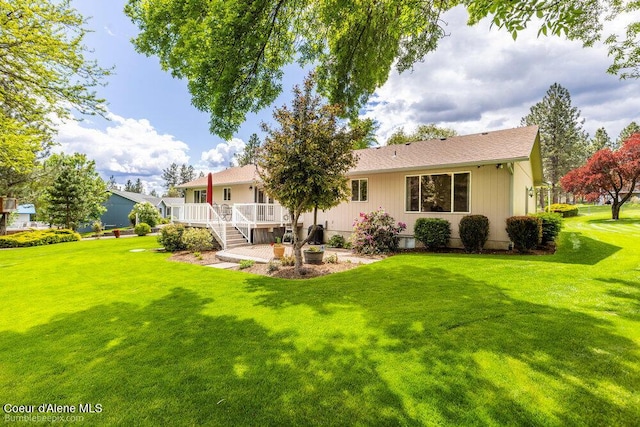 8416 N Haye Ln, Newman Lake, WA 99025 - rear view of house featuring a lawn