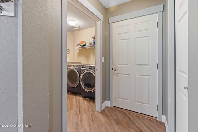 53 Koyokuk Trl, Spirit Lake, ID 83869 - laundry room with independent washer and dryer and wood finished floors