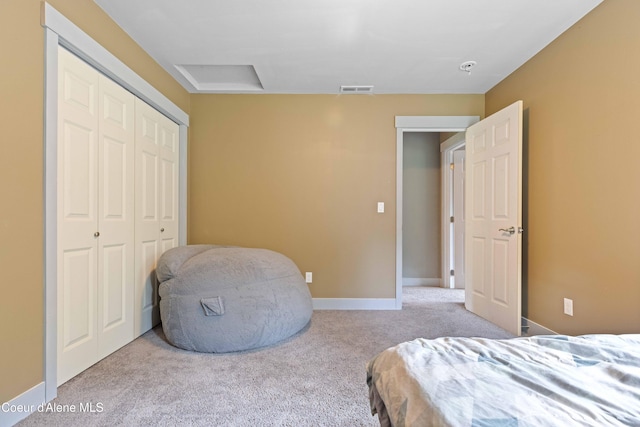53 Koyokuk Trl, Spirit Lake, ID 83869 - bedroom with carpet flooring, a closet, attic access, and baseboards