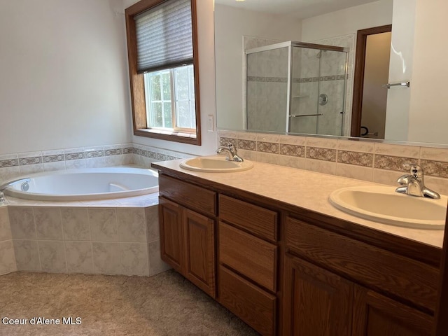 11019 W Crystal Bay Rd, Post Falls, ID 83854 - bathroom with a shower stall, a bath, and double vanity