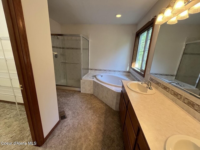 11019 W Crystal Bay Rd, Post Falls, ID 83854 - bathroom featuring double vanity, a shower stall, a garden tub, and recessed lighting