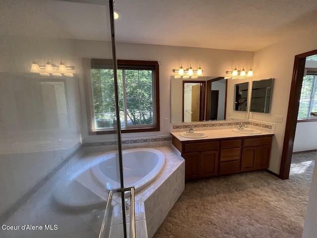 11019 W Crystal Bay Rd, Post Falls, ID 83854 - bathroom with double vanity and a garden tub