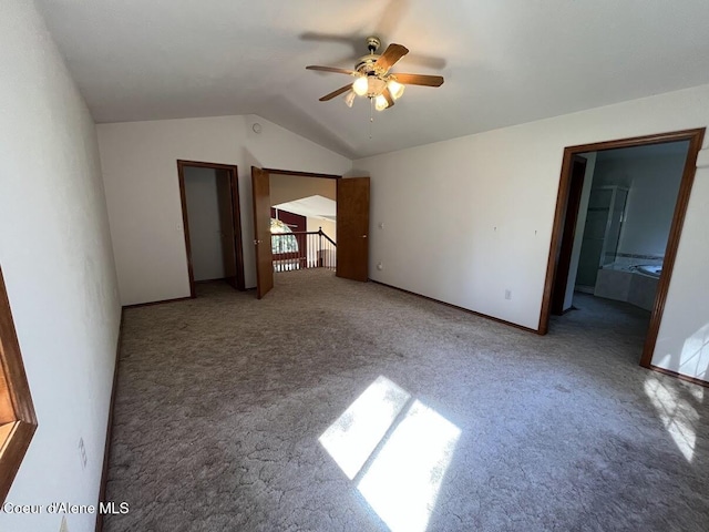 11019 W Crystal Bay Rd, Post Falls, ID 83854 - unfurnished bedroom with carpet flooring, vaulted ceiling, baseboards, and ceiling fan
