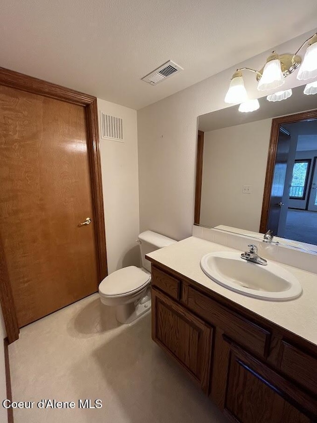 11019 W Crystal Bay Rd, Post Falls, ID 83854 - half bath featuring vanity and toilet