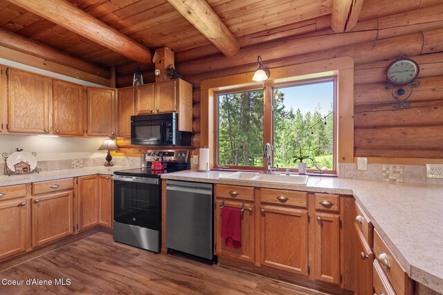 2609 W Seasons Rd, Athol, ID 83801 - kitchen featuring stainless steel appliances, a sink, log walls, light countertops, and wood ceiling with exposed beams