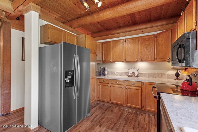 2609 W Seasons Rd, Athol, ID 83801 - kitchen featuring stainless steel appliances, wood finished floors, light countertops, wooden ceiling with exposed beams, and brown cabinets