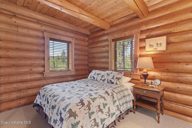 2609 W Seasons Rd, Athol, ID 83801 - bedroom with multiple windows, wooden ceiling with exposed beams, and carpet floors