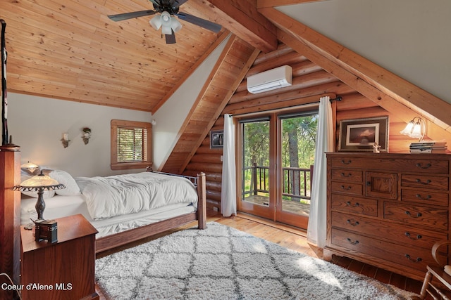2609 W Seasons Rd, Athol, ID 83801 - bedroom with rustic walls, access to exterior, an AC wall unit, and hardwood / wood-style floors