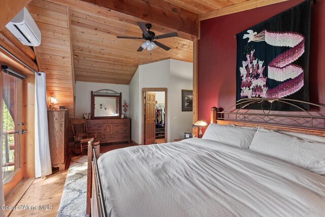 2609 W Seasons Rd, Athol, ID 83801 - bedroom featuring an AC wall unit, wooden ceiling, light wood-style flooring, vaulted ceiling, and a walk in closet