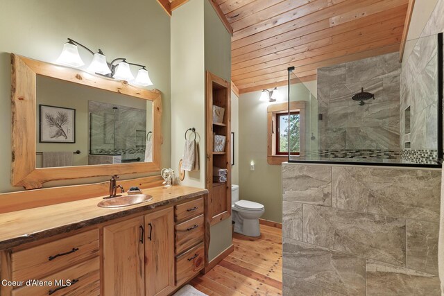 2609 W Seasons Rd, Athol, ID 83801 - bathroom featuring vanity, walk in shower, wood finished floors, wood ceiling, and toilet