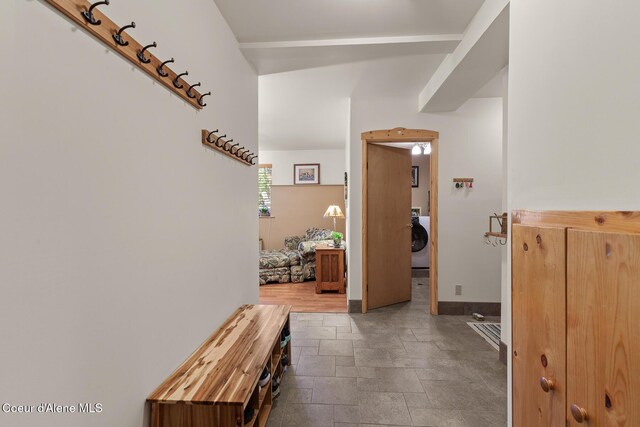 2609 W Seasons Rd, Athol, ID 83801 - hallway with washer / clothes dryer, stone tile floors, and baseboards