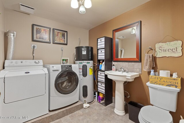 2609 W Seasons Rd, Athol, ID 83801 - laundry area with heat pump water heater and separate washer and dryer