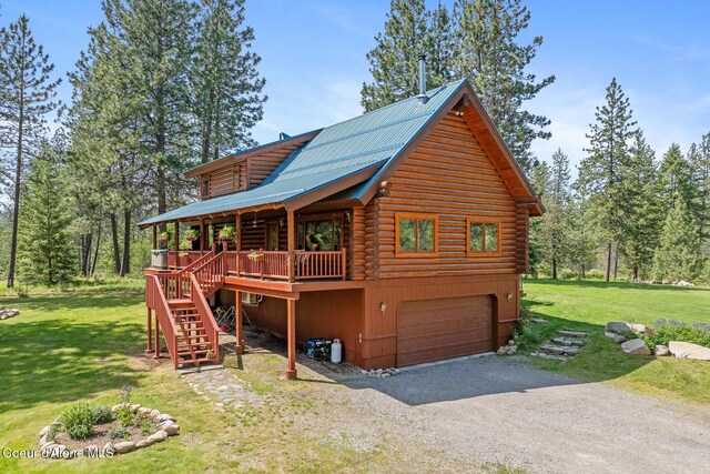 2609 W Seasons Rd, Athol, ID 83801 - view of front facade featuring log exterior, stairs, gravel driveway, and a front yard