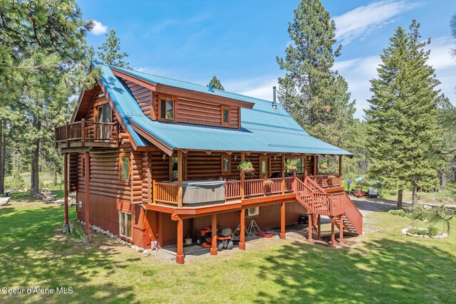 2609 W Seasons Rd, Athol, ID 83801 - rear view of house with log siding, stairway, a yard, metal roof, and a deck