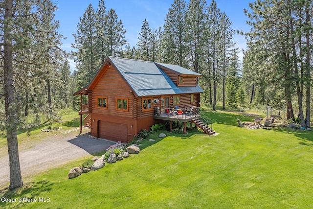 2609 W Seasons Rd, Athol, ID 83801 - view of front of property with log siding, stairs, a garage, dirt driveway, and a front lawn
