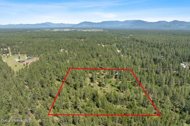 2609 W Seasons Rd, Athol, ID 83801 - view of property location featuring a forest, a mountain backdrop, and property boundaries highlighted