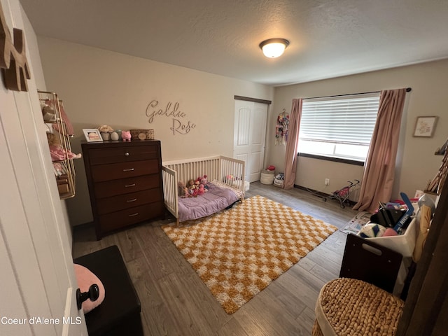 8638 N Spokane St, Post Falls, ID 83854 - bedroom with wood finished floors and a closet