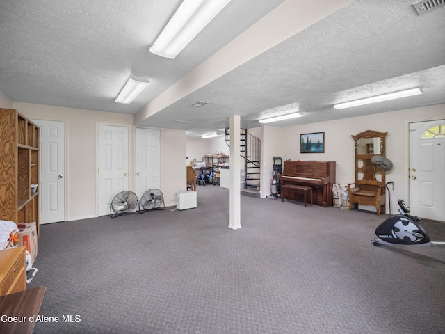 26370 S Hinds Dr, Saint Maries, ID 83861 - finished basement featuring a textured ceiling, carpet floors, and stairs