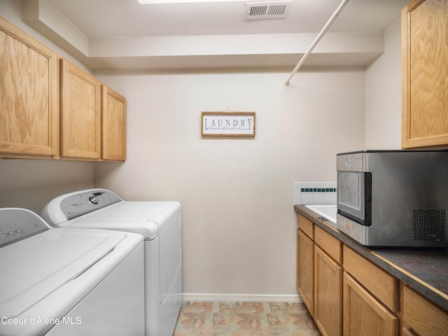 26370 S Hinds Dr, Saint Maries, ID 83861 - washroom with washer and clothes dryer, baseboards, and cabinet space