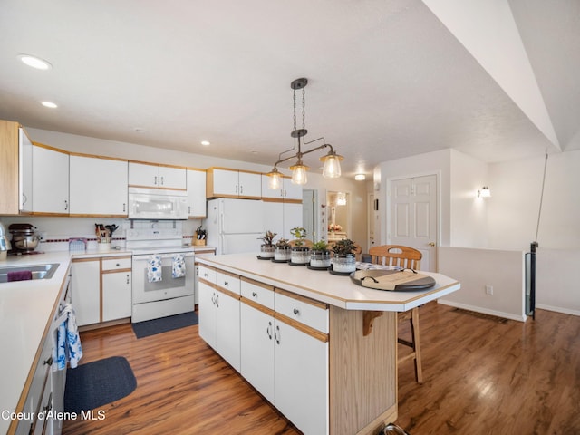 26370 S Hinds Dr, Saint Maries, ID 83861 - kitchen featuring white appliances, a breakfast bar area, white cabinets, light countertops, and recessed lighting