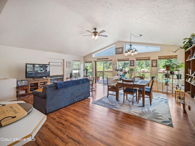 26370 S Hinds Dr, Saint Maries, ID 83861 - living room with wood finished floors, lofted ceiling, ceiling fan, a textured ceiling, and a chandelier