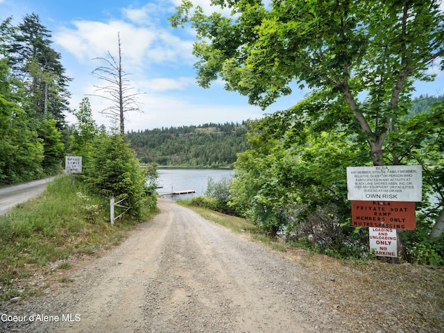 26370 S Hinds Dr, Saint Maries, ID 83861 - view of dirt / gravel road with a water view and a forest view