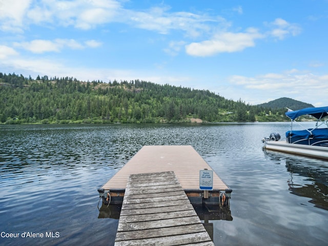 26370 S Hinds Dr, Saint Maries, ID 83861 - dock featuring a wooded view and a water view
