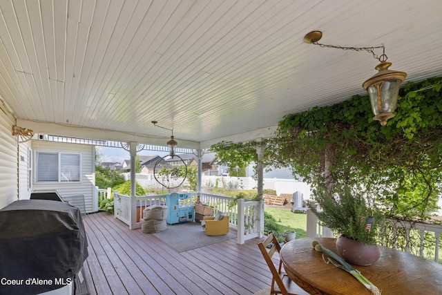 7260 N Courcelles Pkwy, Coeur Dalene, ID 83815 - wooden terrace featuring outdoor dining space and a grill