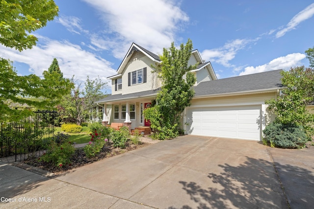 7260 N Courcelles Pkwy, Coeur Dalene, ID 83815 - traditional home with driveway, a garage, and covered porch