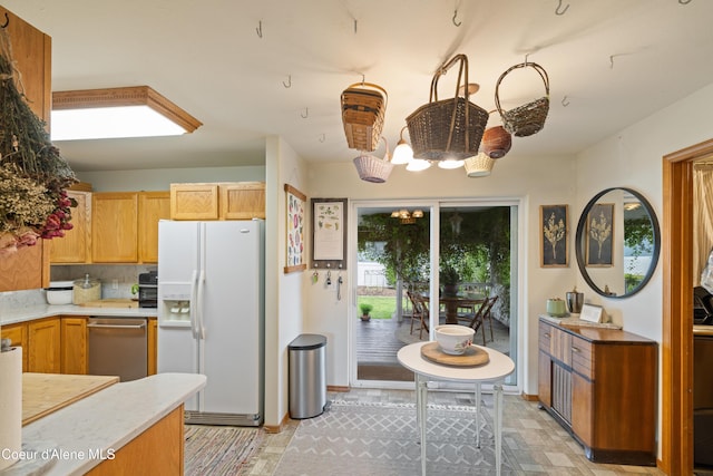 7260 N Courcelles Pkwy, Coeur Dalene, ID 83815 - kitchen featuring white refrigerator with ice dispenser, dishwasher, a chandelier, and light countertops