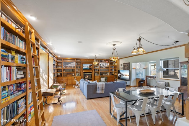 7260 N Courcelles Pkwy, Coeur Dalene, ID 83815 - dining room with light wood-style floors and ornamental molding