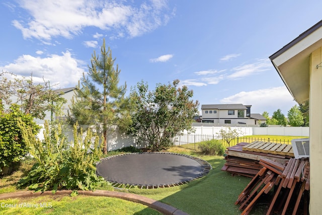 7260 N Courcelles Pkwy, Coeur Dalene, ID 83815 - fenced backyard featuring a trampoline