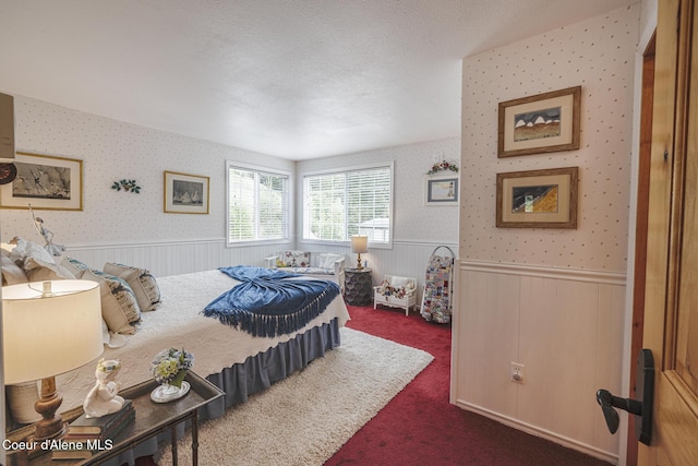 15964 N Songbird Ln, Rathdrum, ID 83858 - carpeted bedroom with wainscoting and wallpapered walls