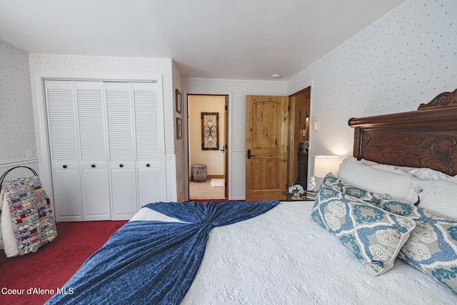 15964 N Songbird Ln, Rathdrum, ID 83858 - bedroom with wallpapered walls, carpet, and a closet