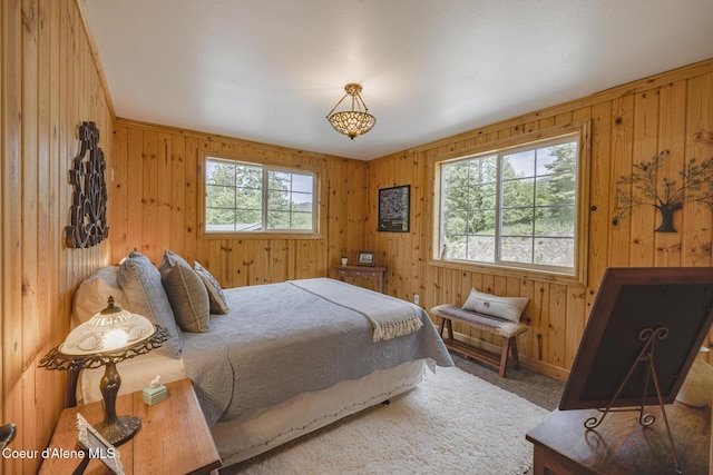 15964 N Songbird Ln, Rathdrum, ID 83858 - bedroom with wood walls and carpet