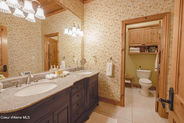 15964 N Songbird Ln, Rathdrum, ID 83858 - bathroom featuring tile patterned floors, double vanity, wallpapered walls, and a chandelier