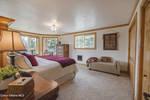 15964 N Songbird Ln, Rathdrum, ID 83858 - bedroom with multiple windows, carpet, a textured ceiling, and crown molding