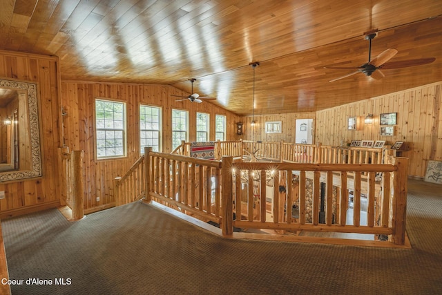 15964 N Songbird Ln, Rathdrum, ID 83858 - corridor with an upstairs landing, wooden walls, carpet floors, lofted ceiling, and wooden ceiling