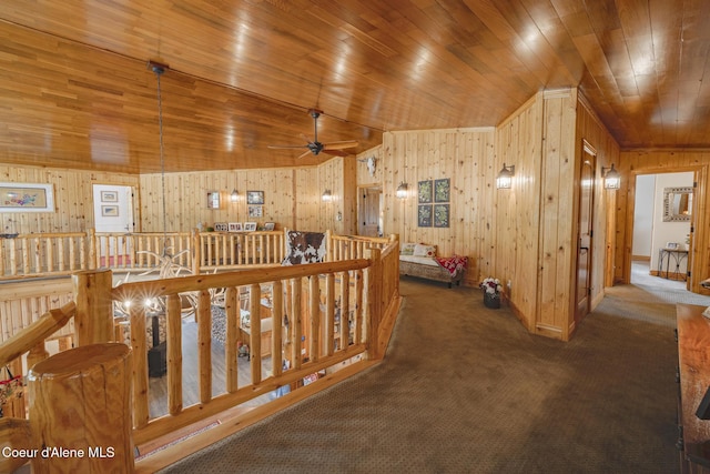 15964 N Songbird Ln, Rathdrum, ID 83858 - hallway with carpet, wood ceiling, an upstairs landing, lofted ceiling, and wood walls