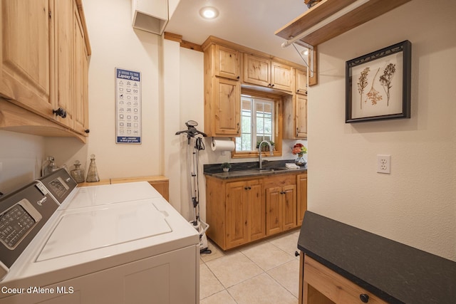 15964 N Songbird Ln, Rathdrum, ID 83858 - laundry area featuring washing machine and dryer, cabinet space, light tile patterned floors, and recessed lighting