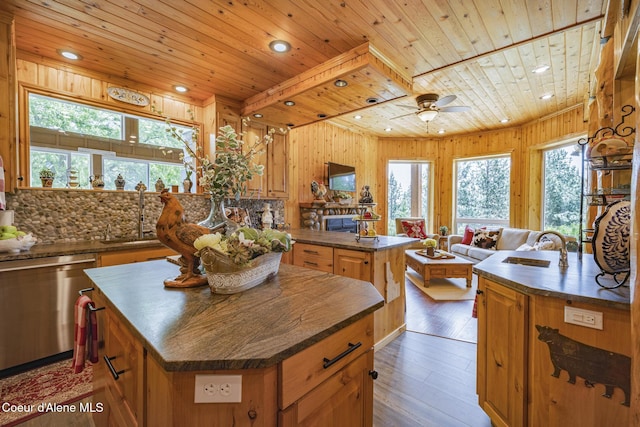 15964 N Songbird Ln, Rathdrum, ID 83858 - kitchen featuring a center island, stainless steel dishwasher, wooden ceiling, dark countertops, and hardwood / wood-style floors