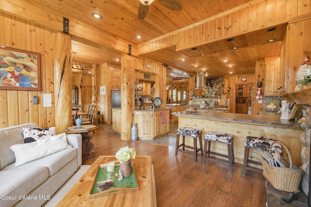 15964 N Songbird Ln, Rathdrum, ID 83858 - living area with wooden ceiling, wood walls, hardwood / wood-style floors, a ceiling fan, and recessed lighting