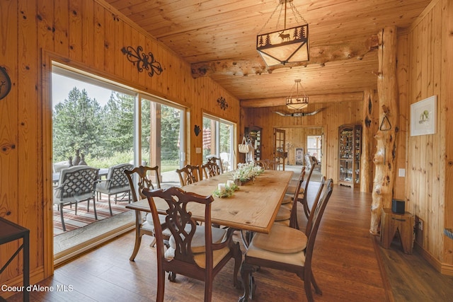15964 N Songbird Ln, Rathdrum, ID 83858 - dining space with wooden walls, wood finished floors, wood ceiling, and vaulted ceiling