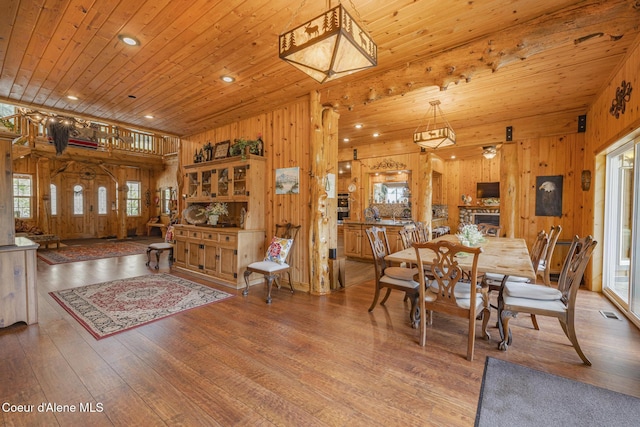 15964 N Songbird Ln, Rathdrum, ID 83858 - dining space featuring wooden walls, wood ceiling, wood finished floors, and recessed lighting