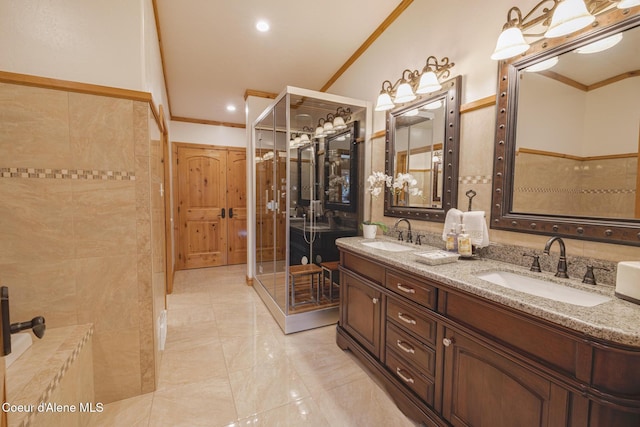 15964 N Songbird Ln, Rathdrum, ID 83858 - bathroom featuring crown molding, double vanity, marble finish flooring, and recessed lighting