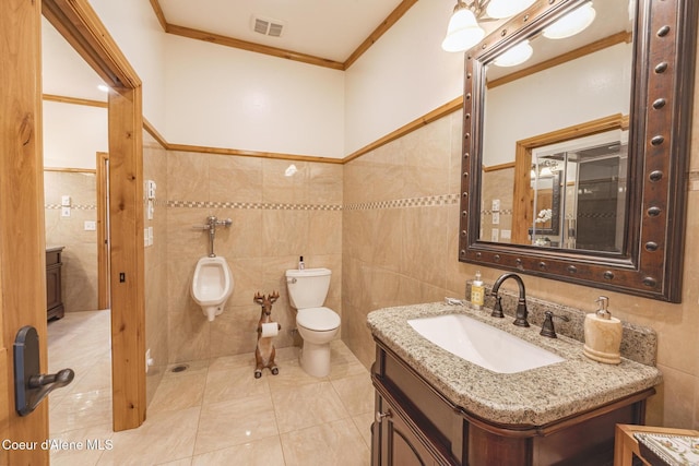 15964 N Songbird Ln, Rathdrum, ID 83858 - bathroom featuring tile walls, crown molding, vanity, and tile patterned flooring