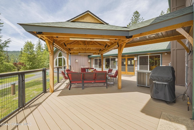 15964 N Songbird Ln, Rathdrum, ID 83858 - wooden terrace featuring grilling area, a gazebo, and an outdoor hangout area