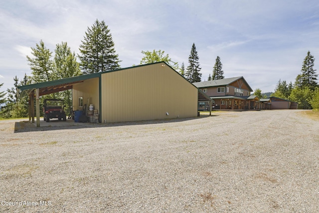 15964 N Songbird Ln, Rathdrum, ID 83858 - view of home's exterior featuring driveway and a carport