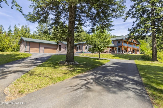 15964 N Songbird Ln, Rathdrum, ID 83858 - view of front of property featuring a garage and a front lawn